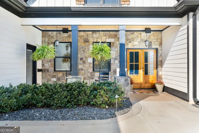 a kitchen with granite countertop a refrigerator and a sink