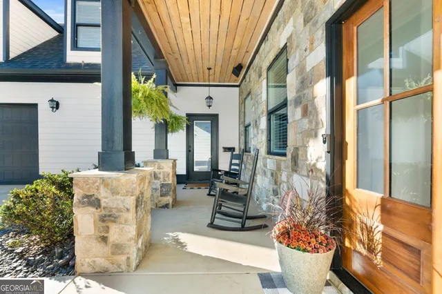 a dining table chairs and a view of kitchen