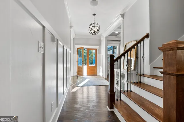 a kitchen with stainless steel appliances white cabinets and a stove top oven