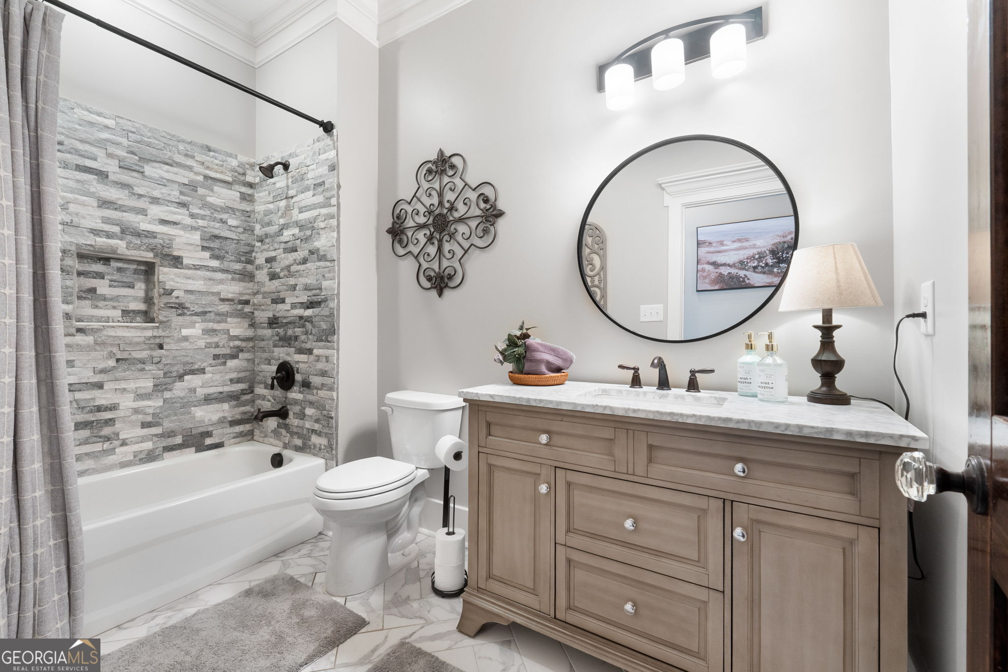 173 Dolly Nixon Road Senoia, GA 30276 - Photo 29 of 105 a bathroom with a granite countertop toilet a sink and a mirror