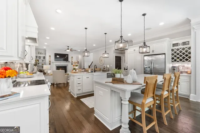 a bathroom with a granite countertop toilet sink and mirror