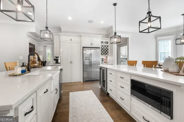 a bathroom with a granite countertop toilet sink and mirror