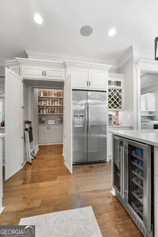 a view of a house with a big yard and potted plants