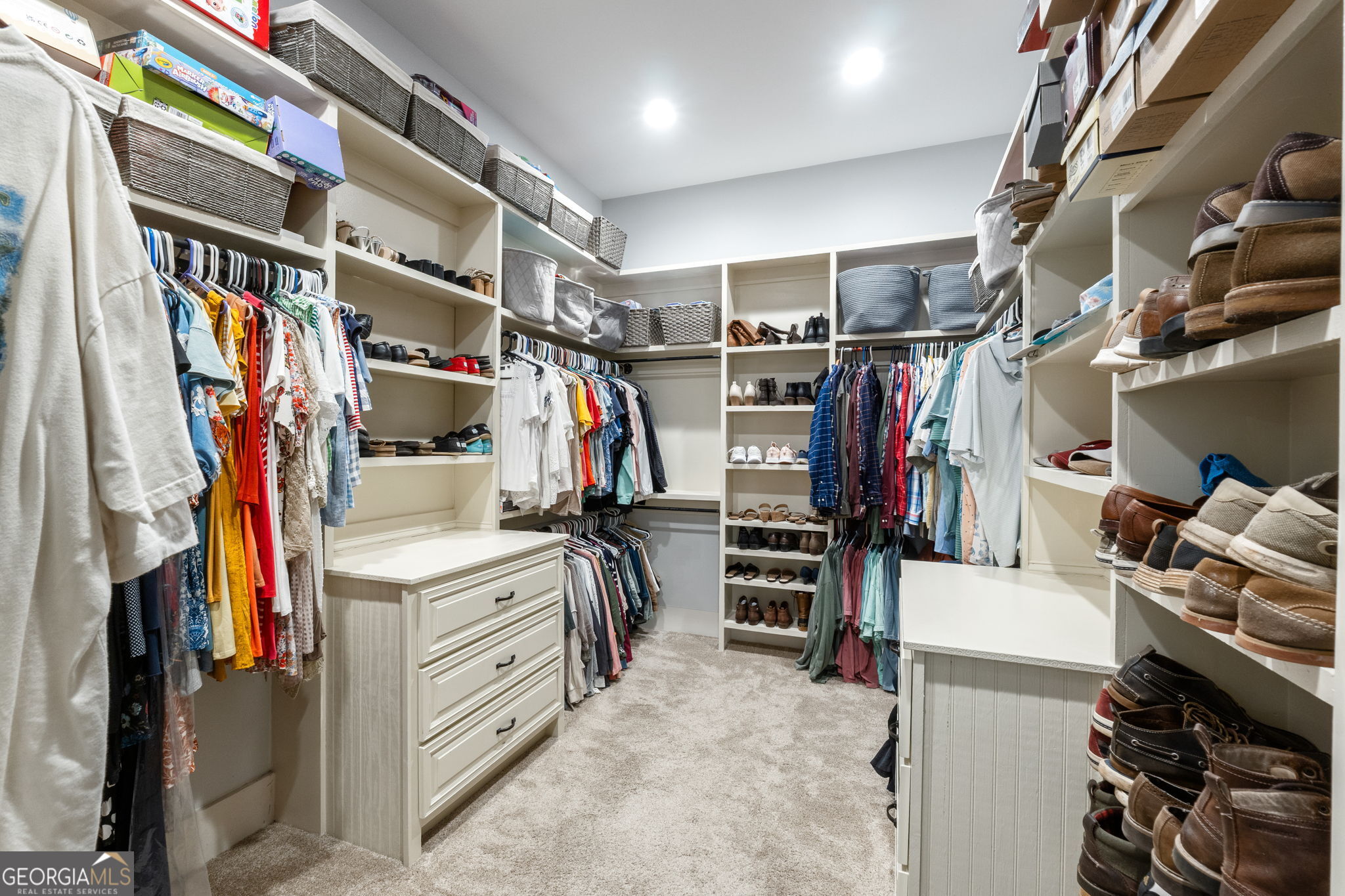 173 Dolly Nixon Road Senoia, GA 30276 - Photo 68 of 105 a view of walk in closet with clothes and shoes