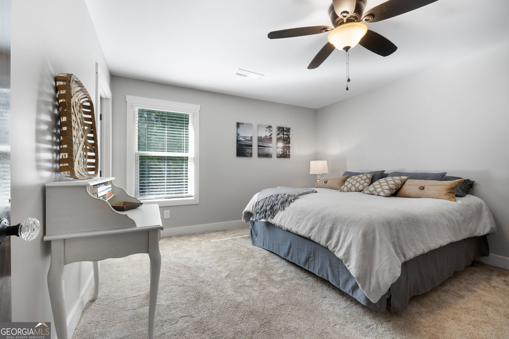 173 Dolly Nixon Road Senoia, GA 30276 - Photo 75 of 105 a spacious bedroom with a bed and a window