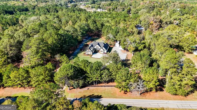 a view of a hallway with windows and closet