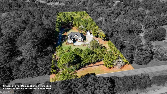 a view of staircase with lots of frames and frames on wall with wooden floor