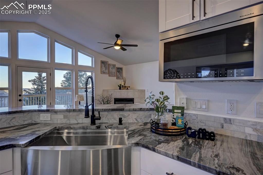 7790 Julynn Road Colorado Springs, CO 80919 - Photo 19 of 50 a kitchen with a sink and potted plant