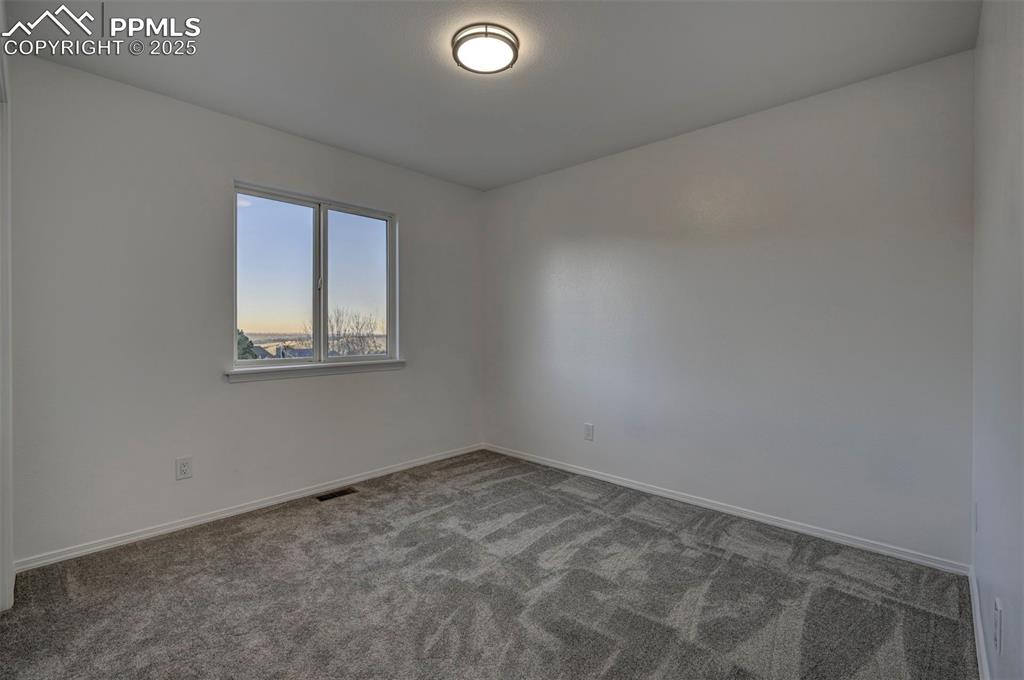 7790 Julynn Road Colorado Springs, CO 80919 - Photo 23 of 50 an empty room with windows