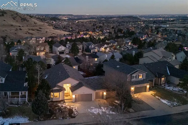 an aerial view of a house with a swimming pool