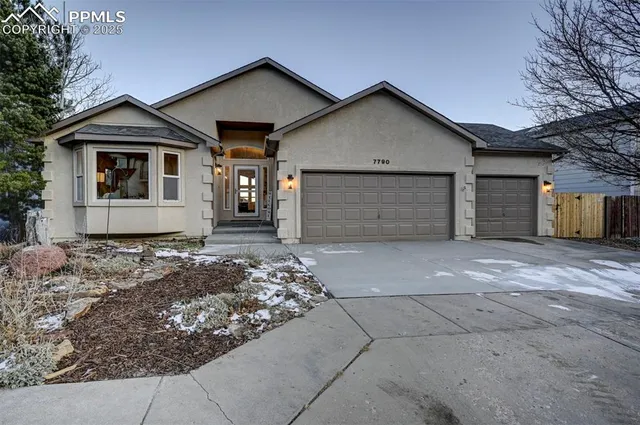 a front view of a house with a garage
