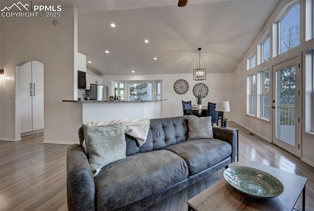 7790 Julynn Road Colorado Springs, CO 80919 - Photo 8 of 50 a living room with furniture and a wooden floor
