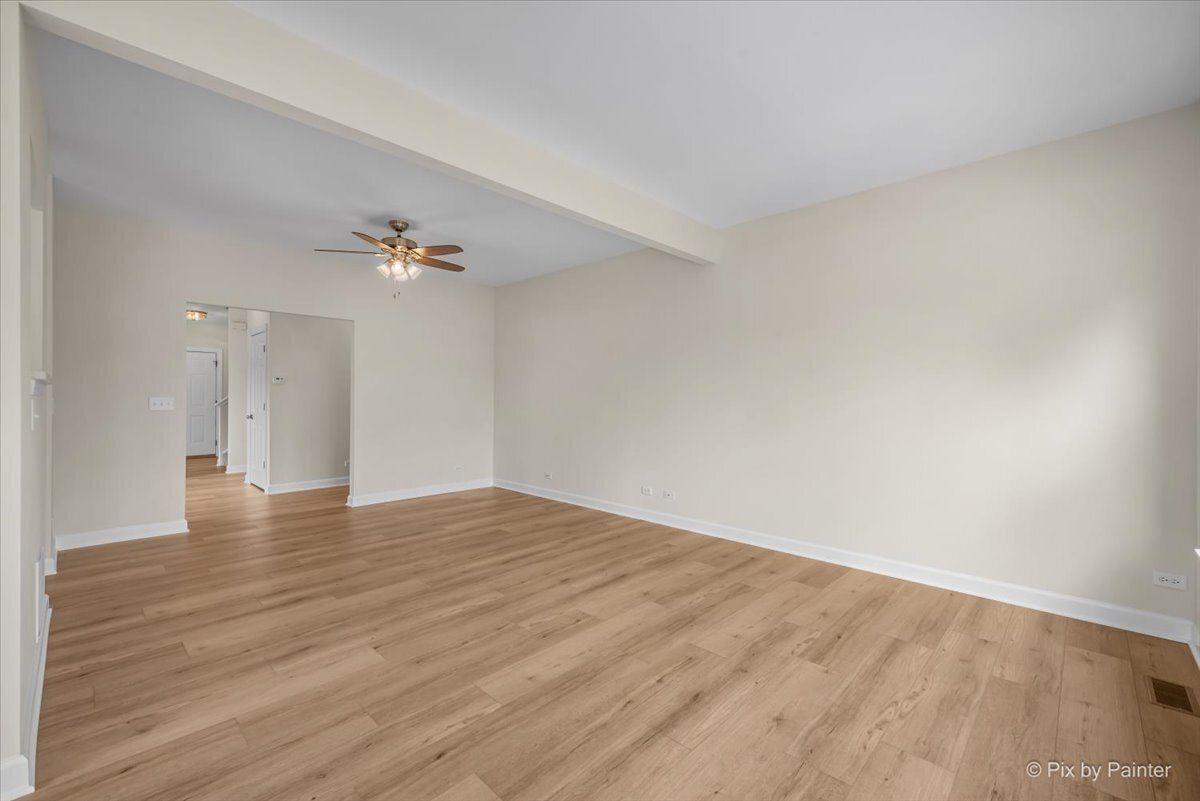 216 Winding Trail Genoa, IL 60135 - Photo 11 of 52 a view of an empty room with wooden floor