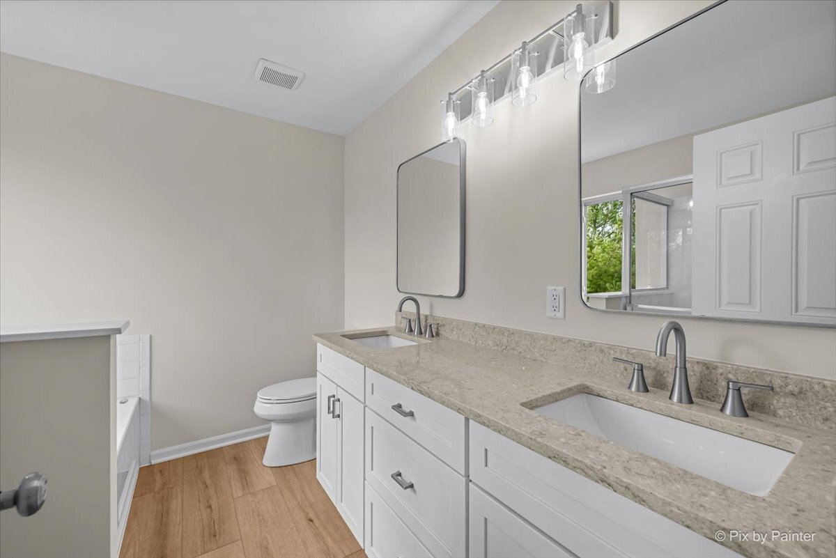 216 Winding Trail Genoa, IL 60135 - Photo 23 of 52 a bathroom with a granite countertop sink mirror and toilet