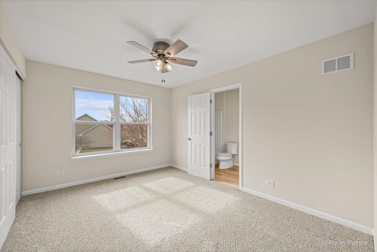 216 Winding Trail Genoa, IL 60135 - Photo 26 of 52 a view of an empty room with a window