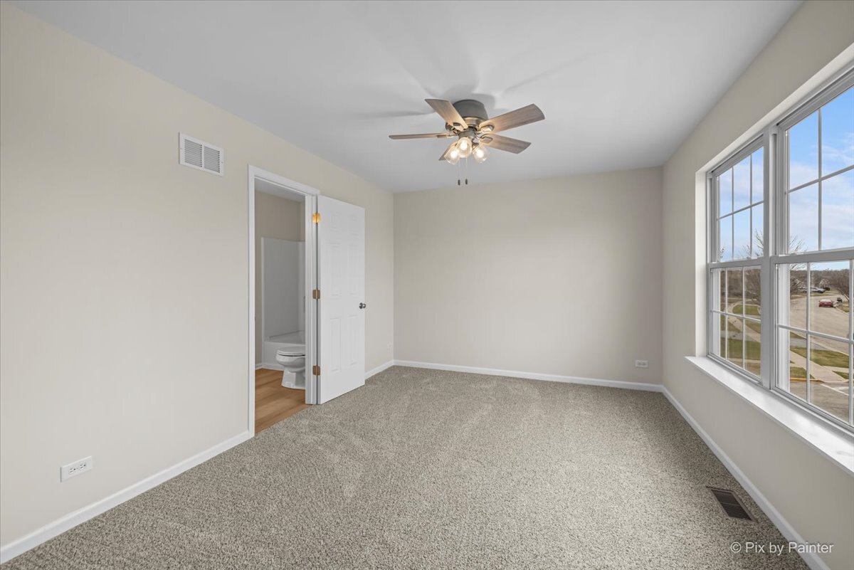 216 Winding Trail Genoa, IL 60135 - Photo 31 of 52 a view of empty room with window