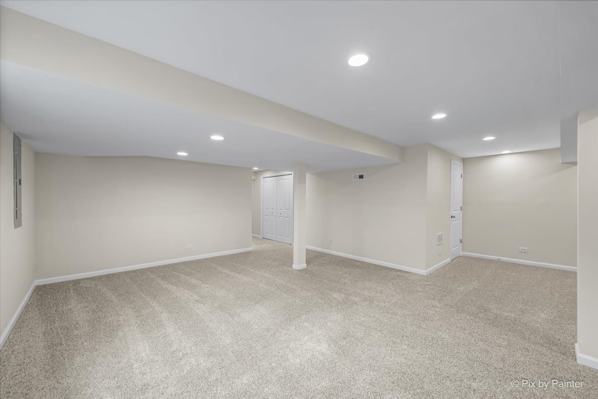 216 Winding Trail Genoa, IL 60135 - Photo 36 of 52 an empty room with windows