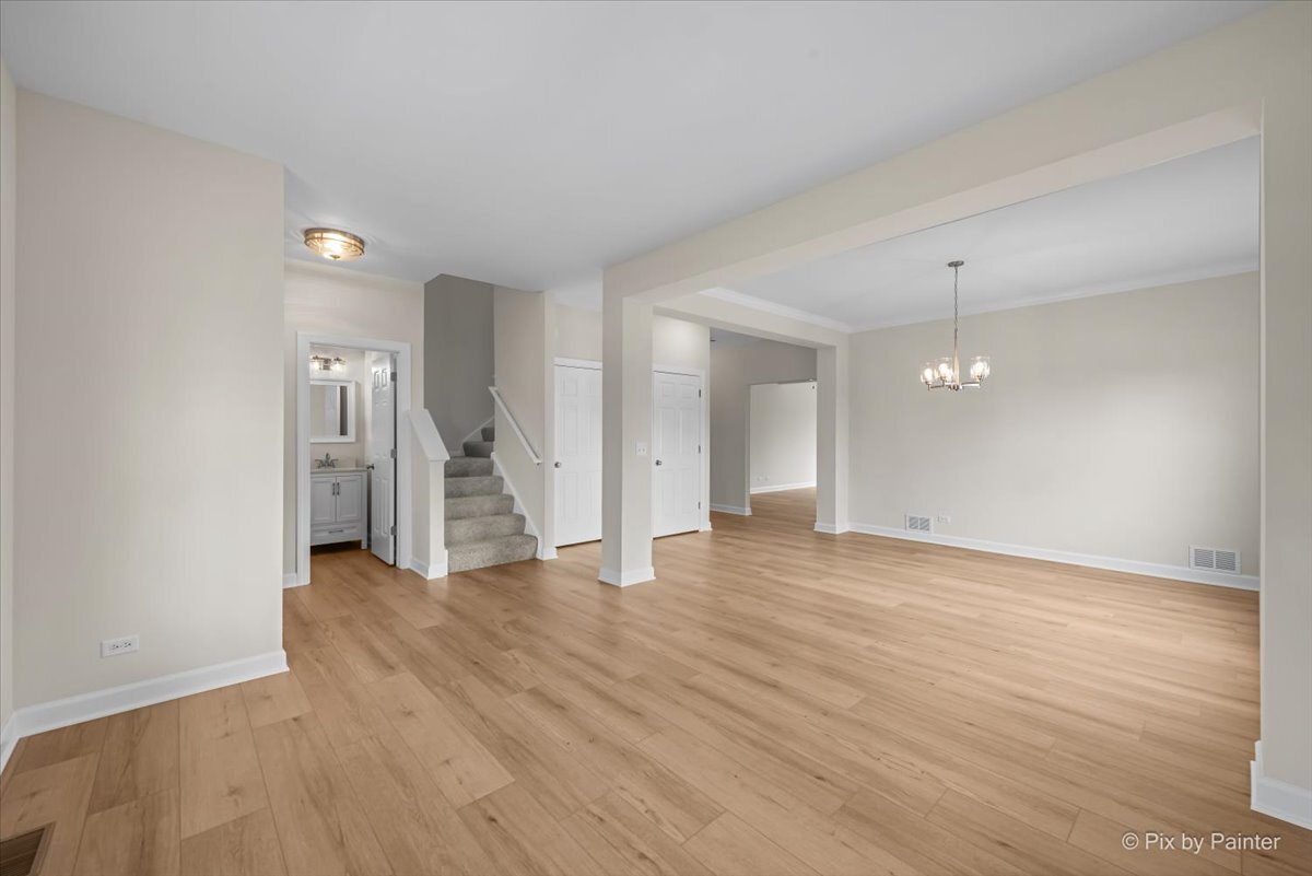 216 Winding Trail Genoa, IL 60135 - Photo 5 of 52 wooden floor in an empty room with a window