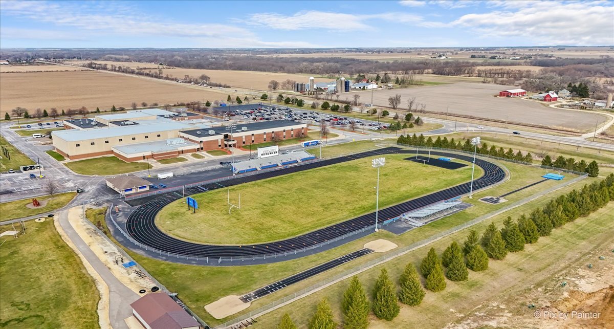 216 Winding Trail Genoa, IL 60135 - Photo 51 of 52 a view of a swimming pool with a table and chairs