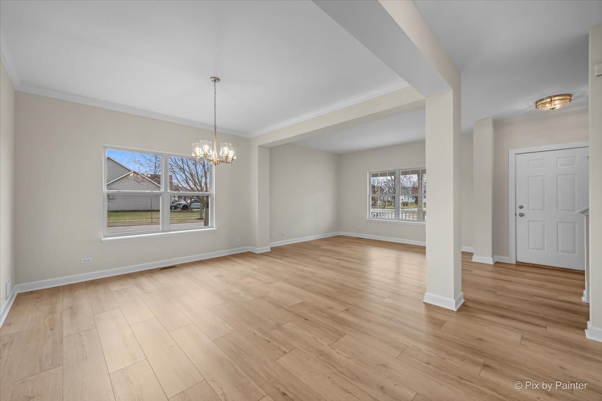 216 Winding Trail Genoa, IL 60135 - Photo 6 of 52 a view of livingroom with hardwood floor and window