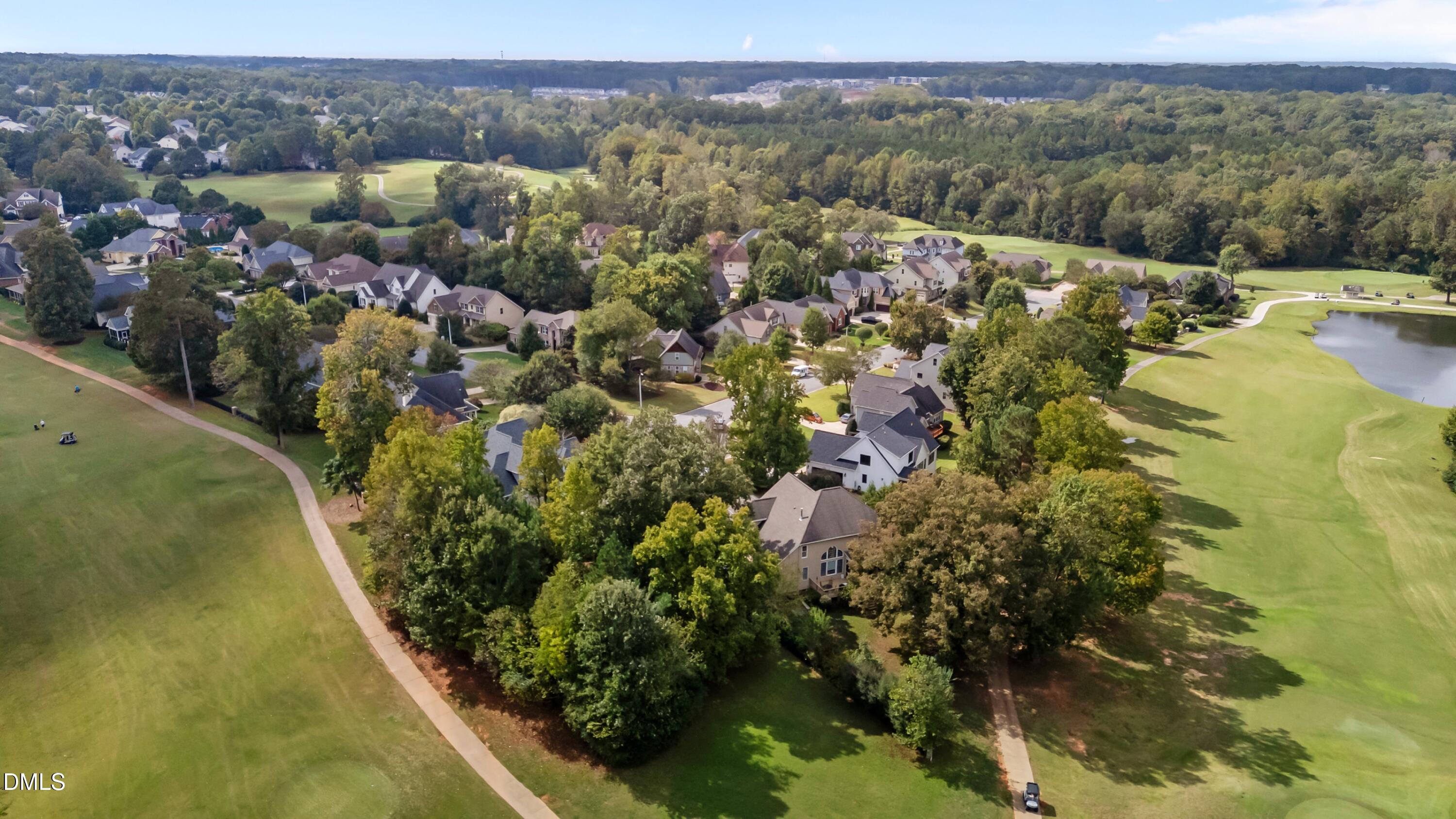 442 Waterville Street Raleigh, NC 27603 - Photo 13 of 22 a view of a lake with a mountain in the background