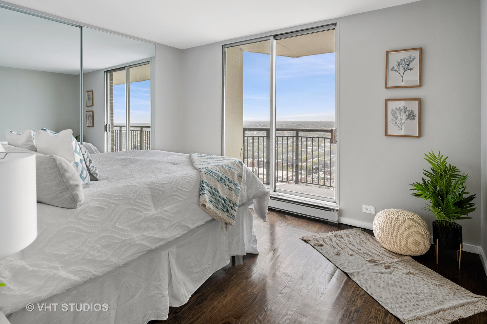 6007 North Sheridan Road, Unit 37J Chicago, IL 60660 - Photo 16 of 26 a bedroom with a bed and wooden floor