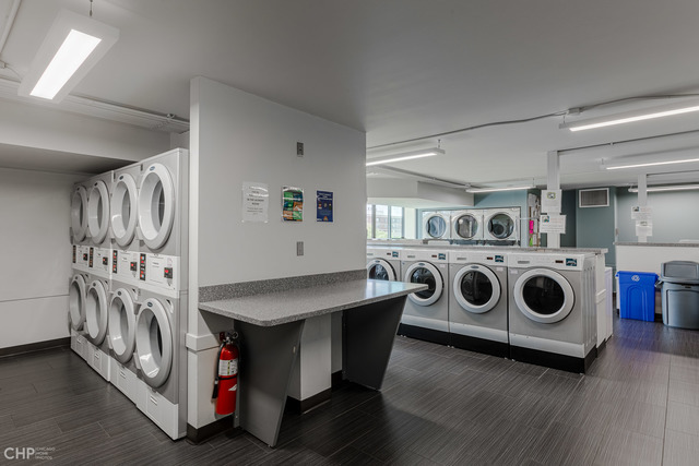 6007 North Sheridan Road, Unit 37J Chicago, IL 60660 - Photo 23 of 26 a utility room with dryer washer and stair