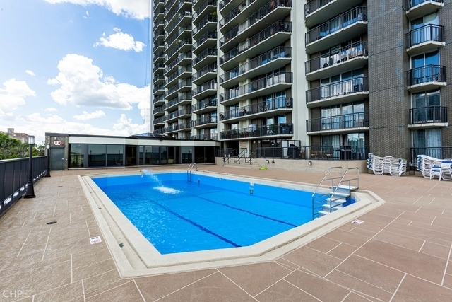 6007 North Sheridan Road, Unit 37J Chicago, IL 60660 - Photo 26 of 26 a view of swimming pool with building in the background
