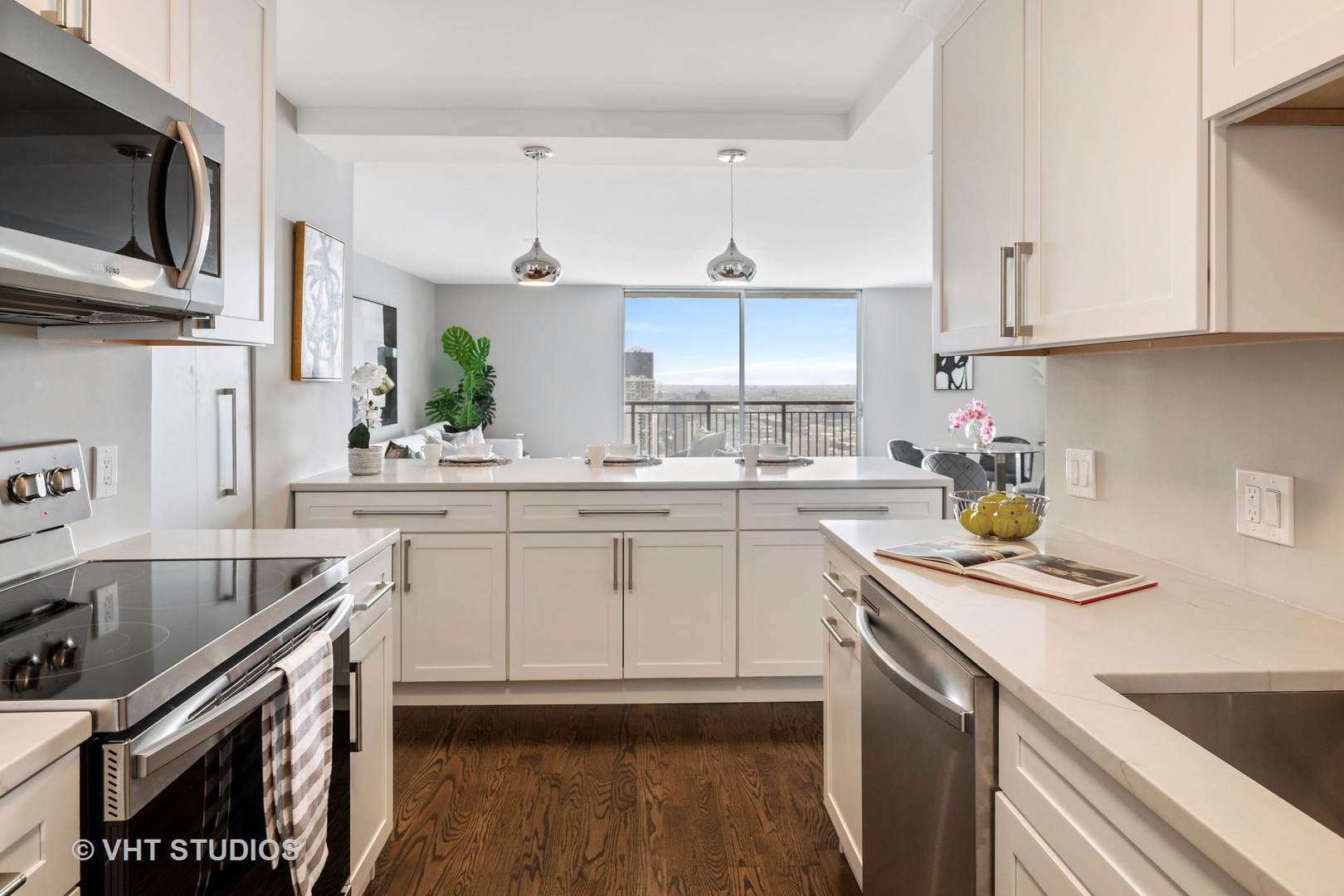 6007 North Sheridan Road, Unit 37J Chicago, IL 60660 - Photo 8 of 26 a kitchen with a sink stove and cabinets