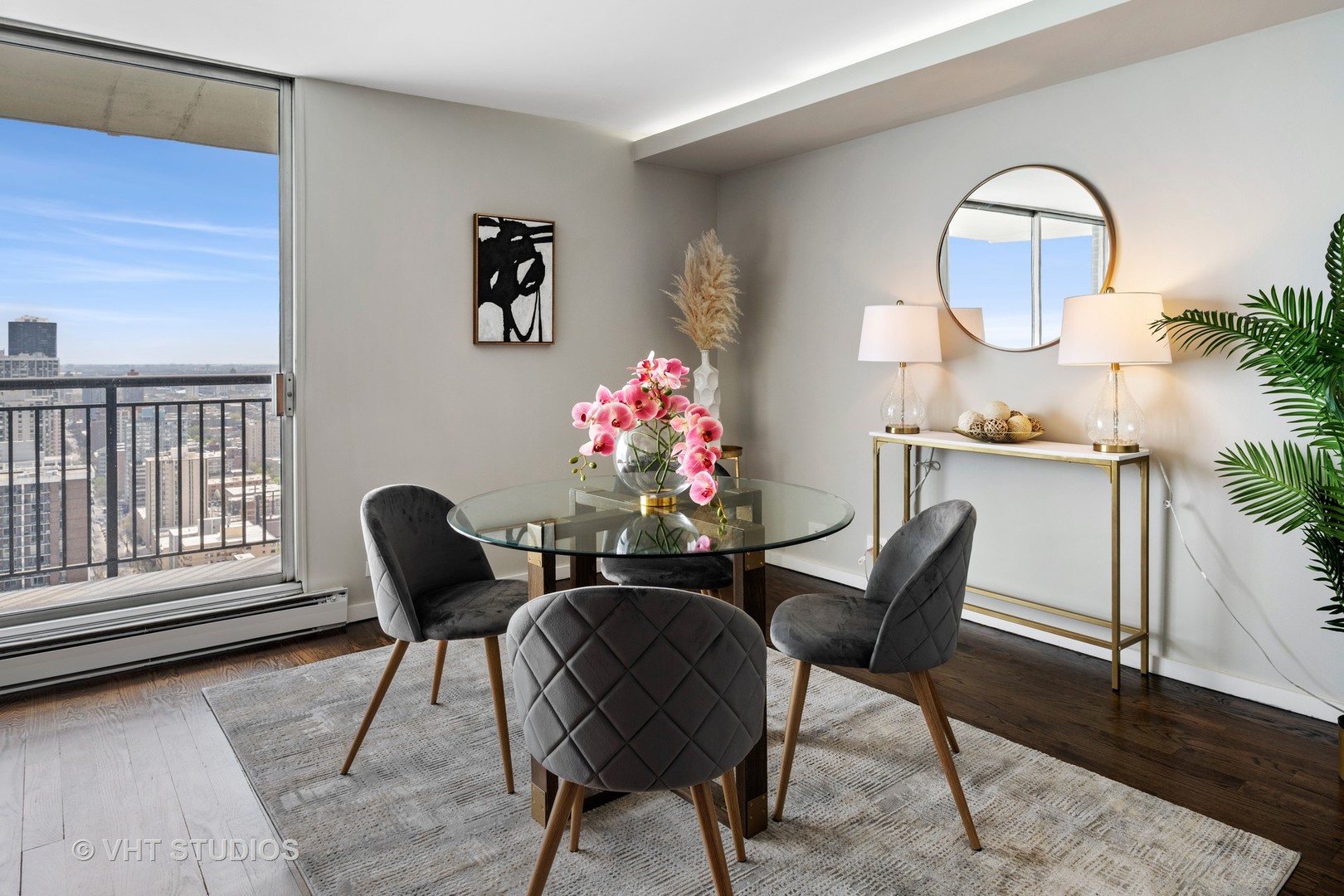 6007 North Sheridan Road, Unit 37J Chicago, IL 60660 - Photo 10 of 26 a dining room with furniture and a mirror