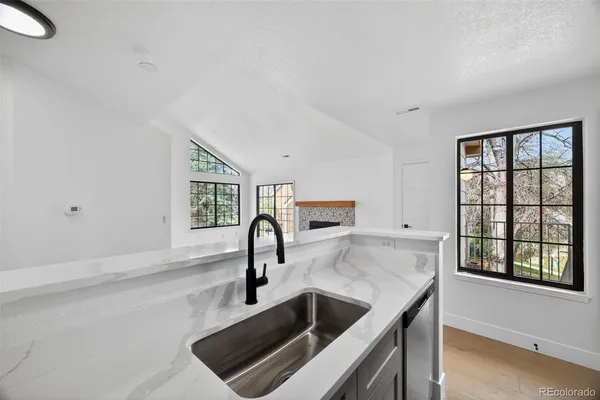 a kitchen with a sink and a window