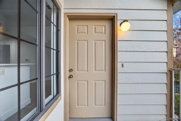 a view of balcony with wooden floor and outdoor seating