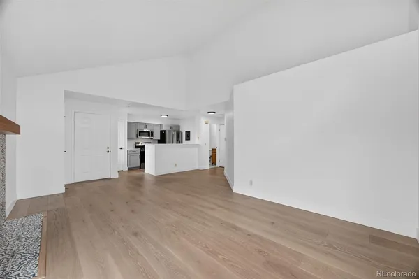 a view of a kitchen with wooden floor
