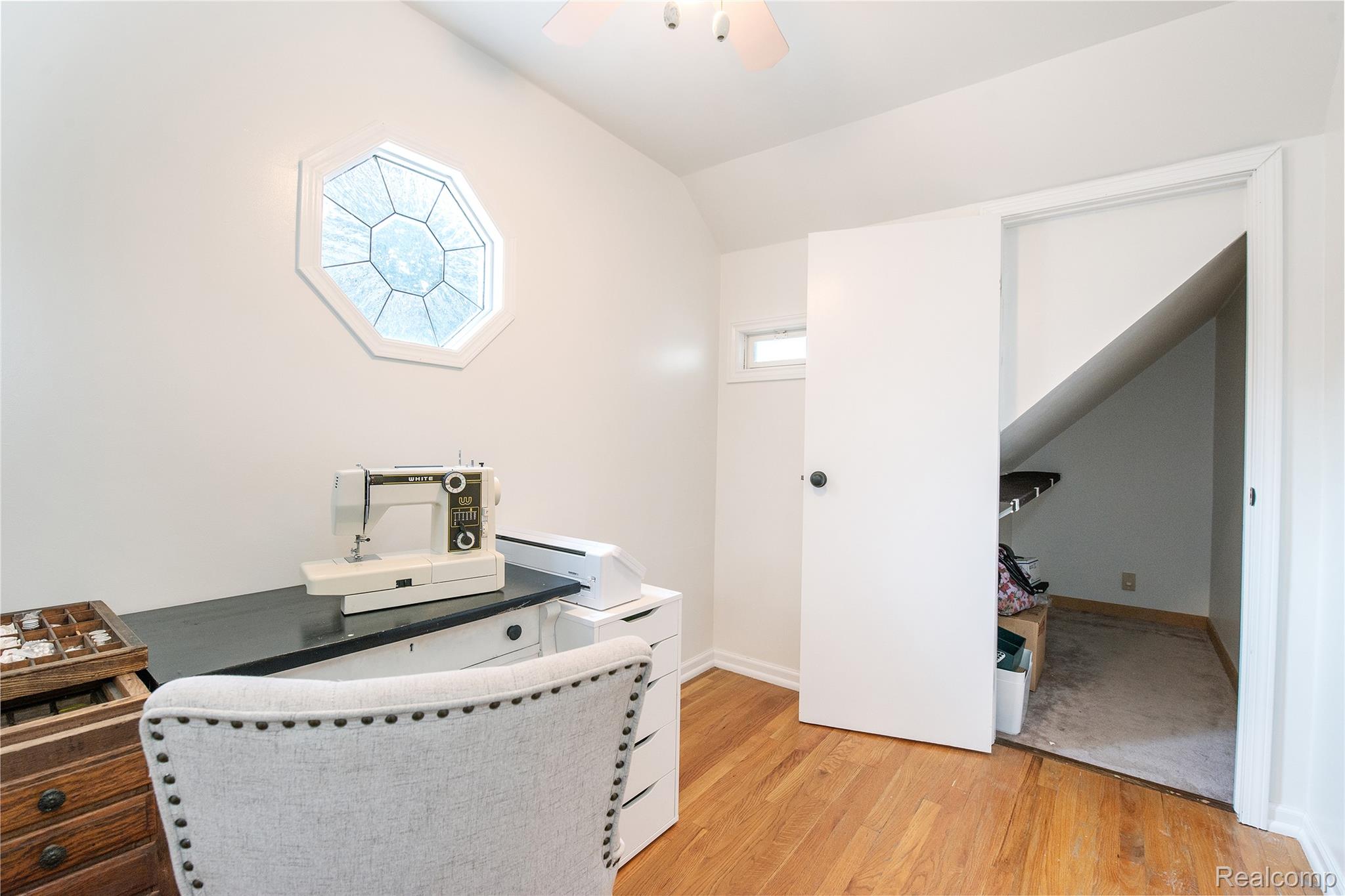22 Cloverport Avenue Rochester, MI 48307 - Photo 23 of 48 Octagonal transom window, wood-finish flooring, built-in storage, white walls, and a ceiling fan