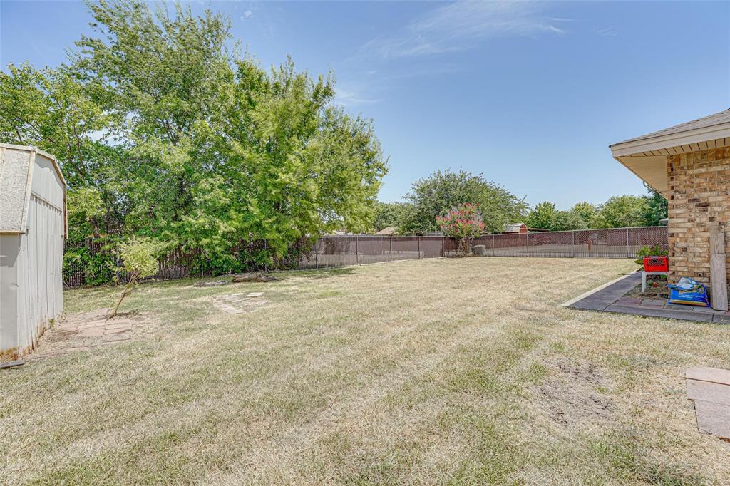 1418 Ridge Drive Midlothian, TX 76065 - Photo 3 of 12 Fenced backyard with a patio area