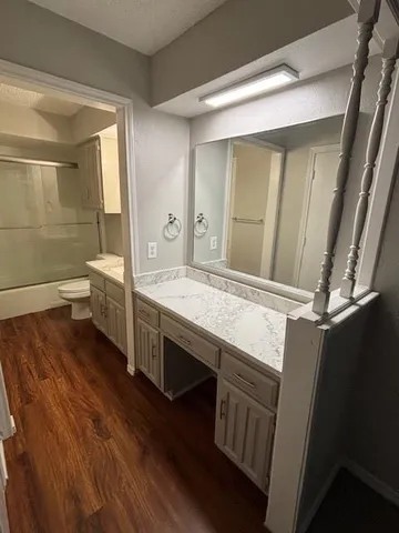 a bathroom with a double vanity sink and a mirror
