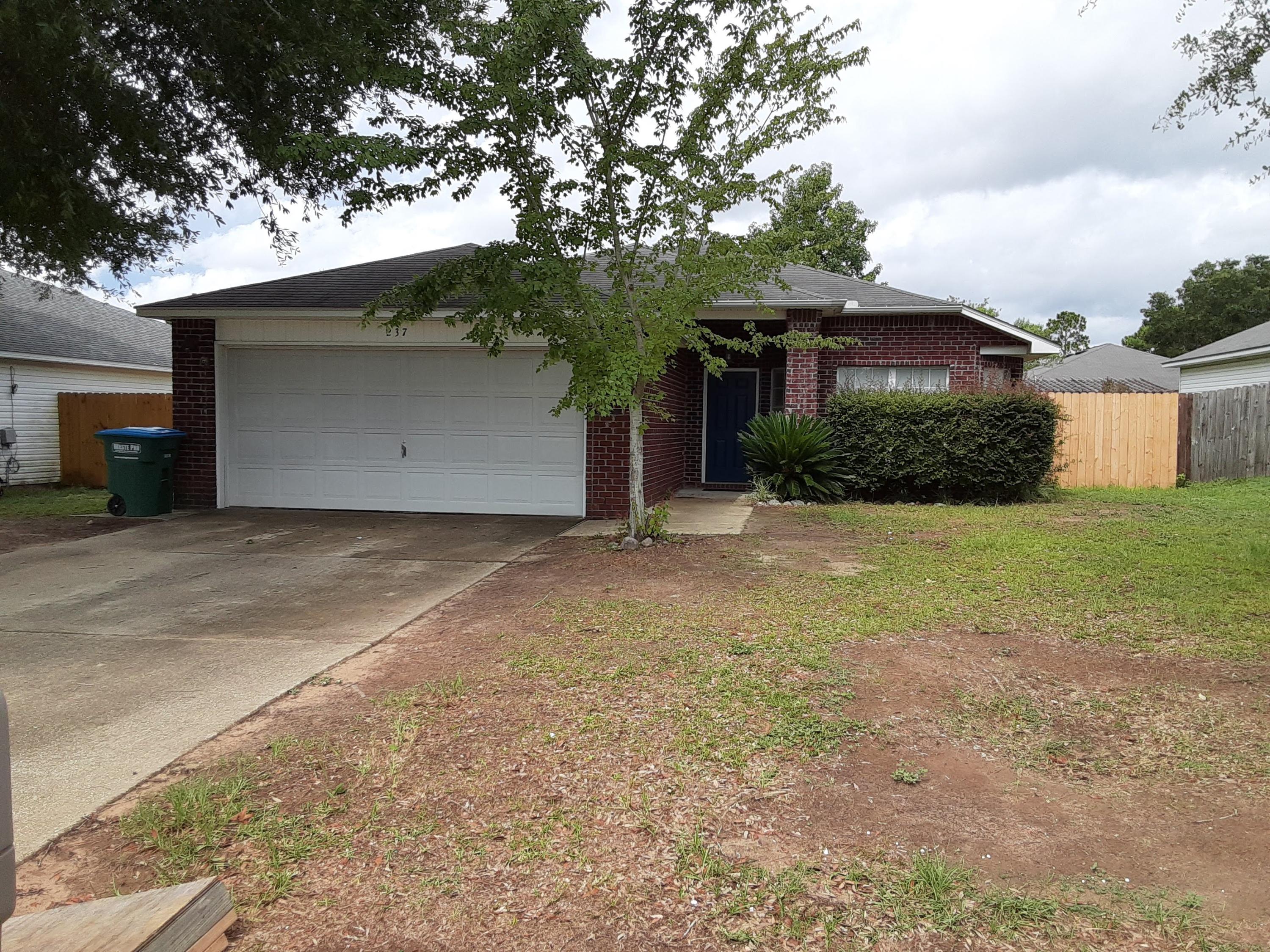 237 Limestone Circle Crestview, FL 32539 - Photo 1 of 15 a view of a house with a yard
