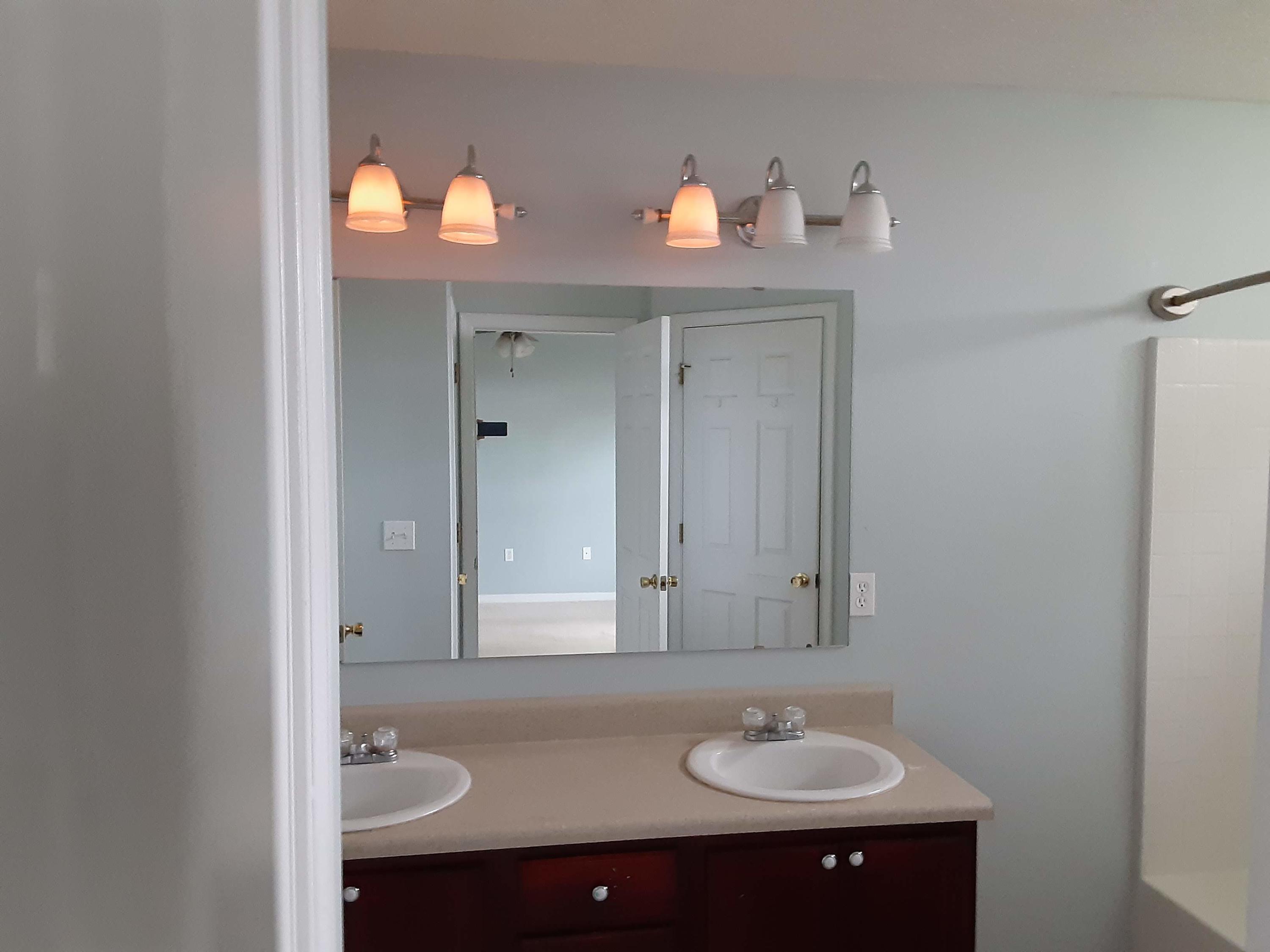 237 Limestone Circle Crestview, FL 32539 - Photo 12 of 15 a bathroom with a sink and a mirror