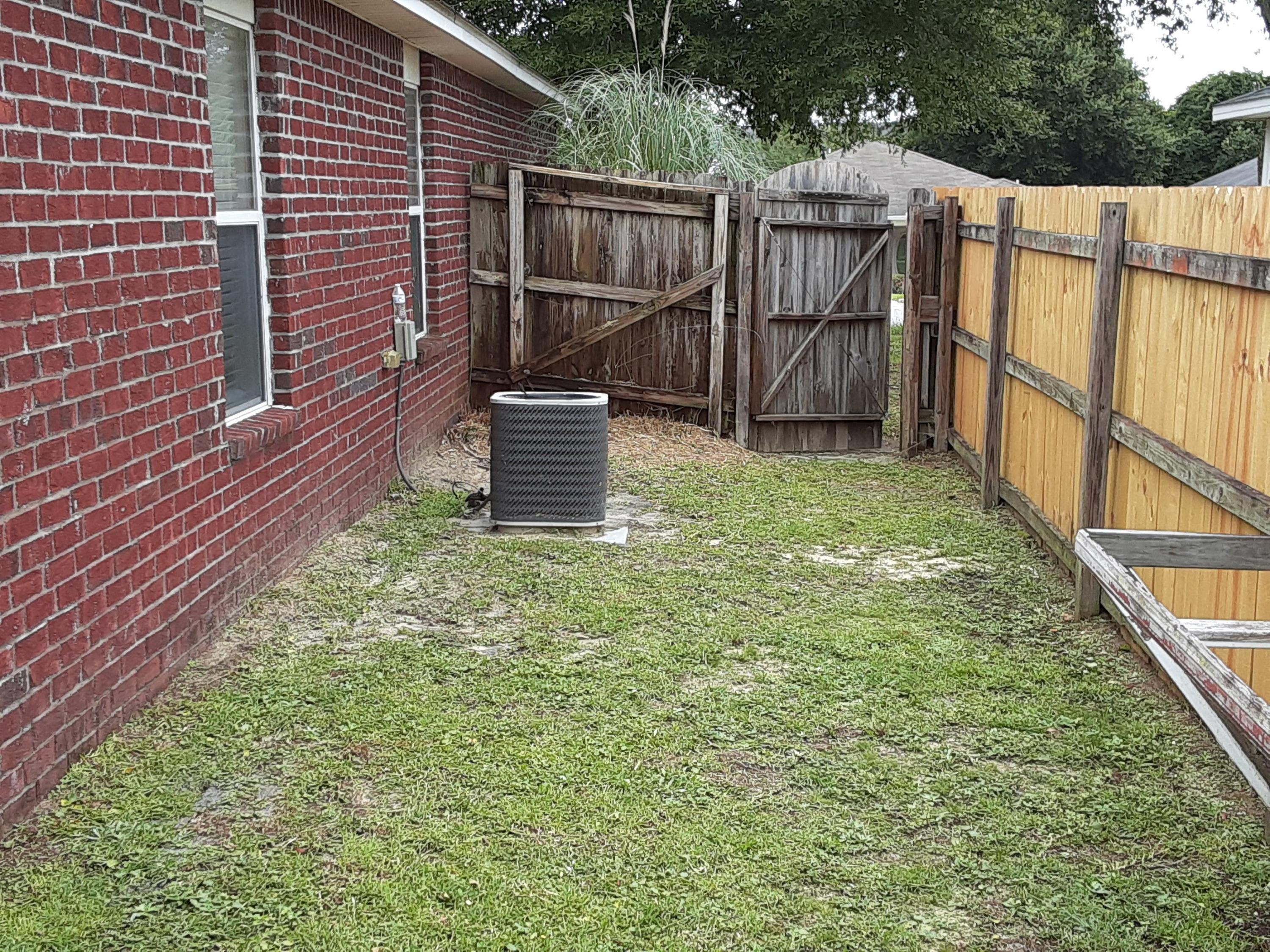 237 Limestone Circle Crestview, FL 32539 - Photo 14 of 15 a view of a backyard