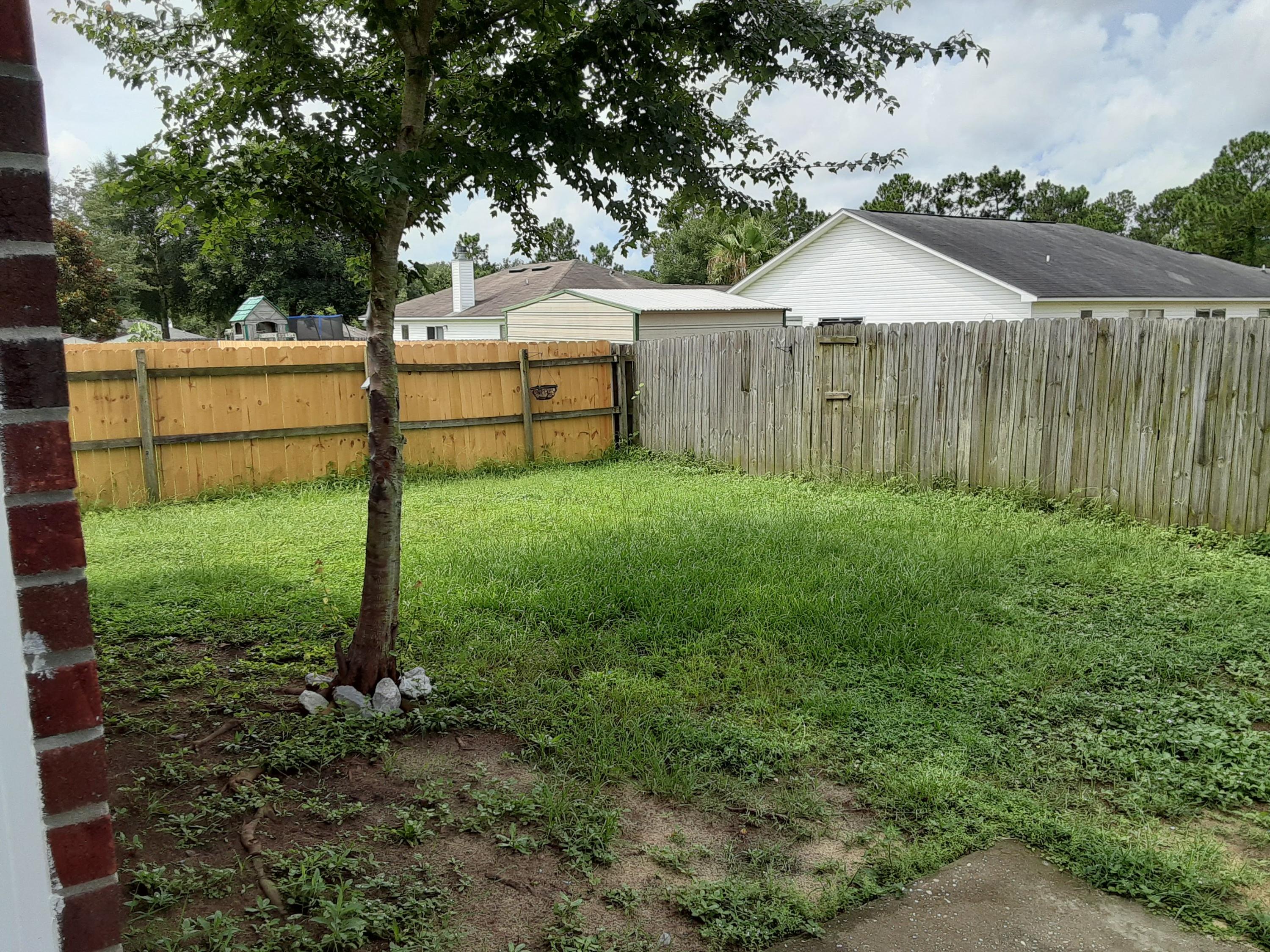 237 Limestone Circle Crestview, FL 32539 - Photo 4 of 15 a view of a backyard with a garden