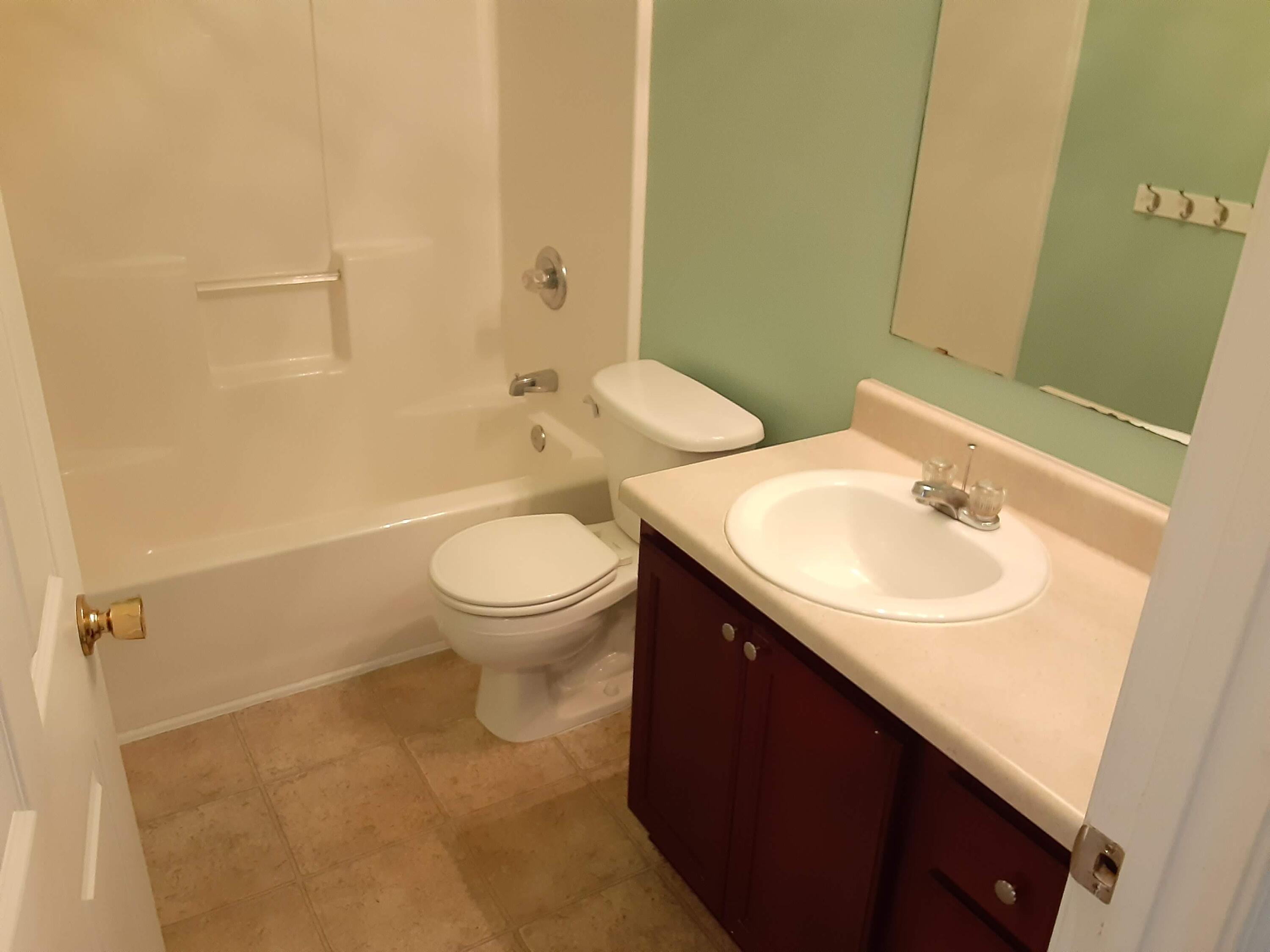 237 Limestone Circle Crestview, FL 32539 - Photo 8 of 15 a bathroom with a sink toilet and a mirror