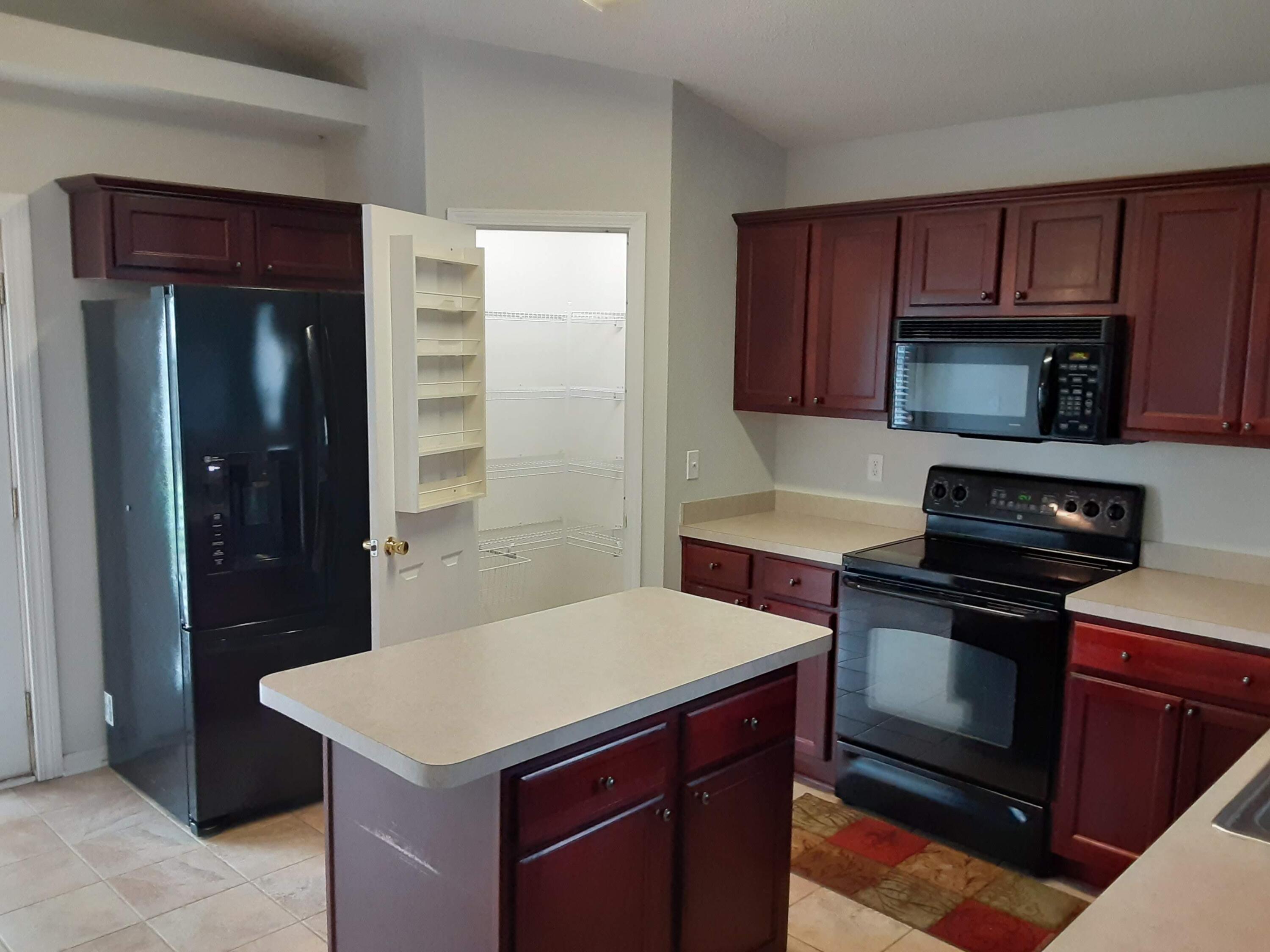 237 Limestone Circle Crestview, FL 32539 - Photo 9 of 15 a kitchen with a stove and a microwave
