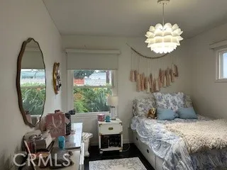 a bed room with a bed and a window