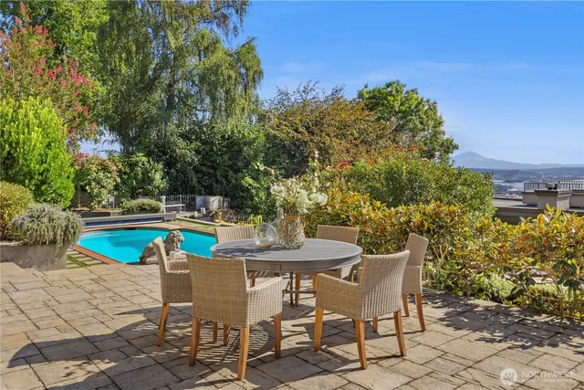 a view of a swimming pool with chairs
