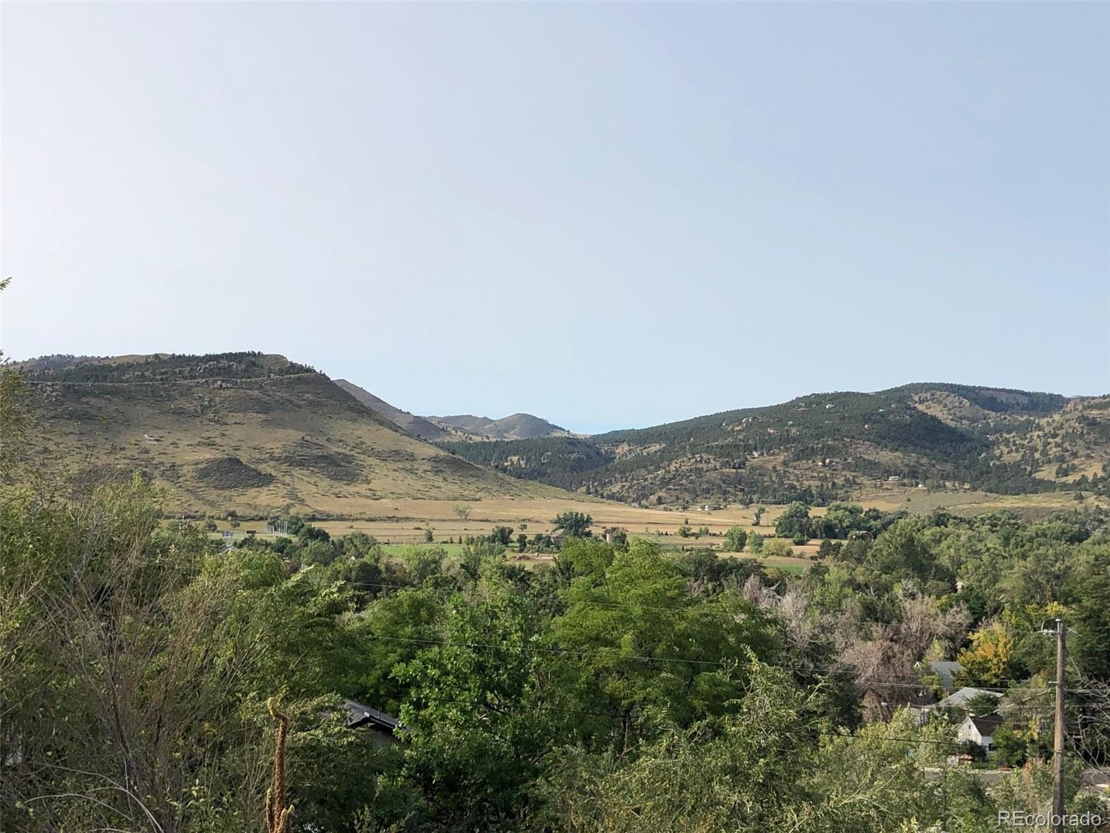 620 Overlook Drive Lyons, CO 80540 - Photo 2 of 11 a view of a mountain range with lush green forest