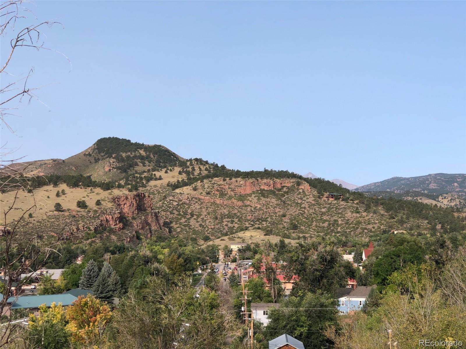 620 Overlook Drive Lyons, CO 80540 - Photo 4 of 11 a view of a mountain range in a cloudy sky