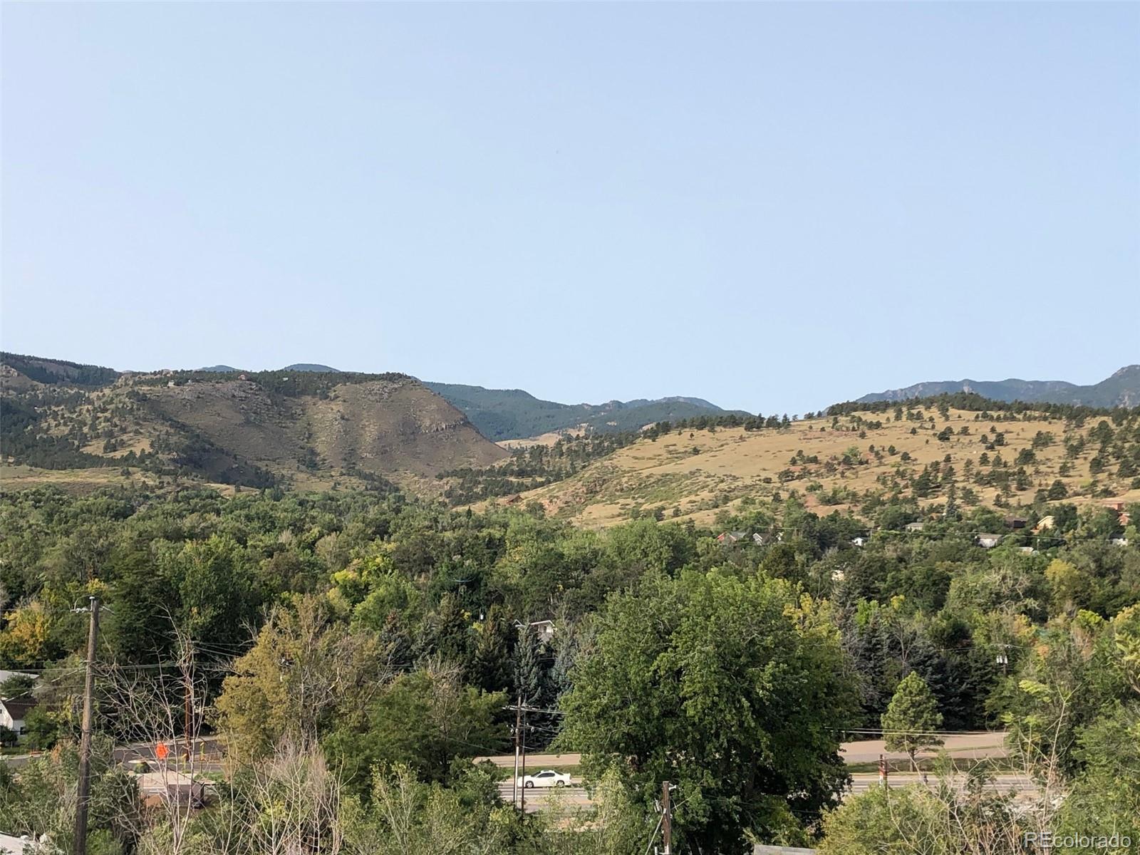 620 Overlook Drive Lyons, CO 80540 - Photo 6 of 11 a view of a mountain range in a cloudy sky