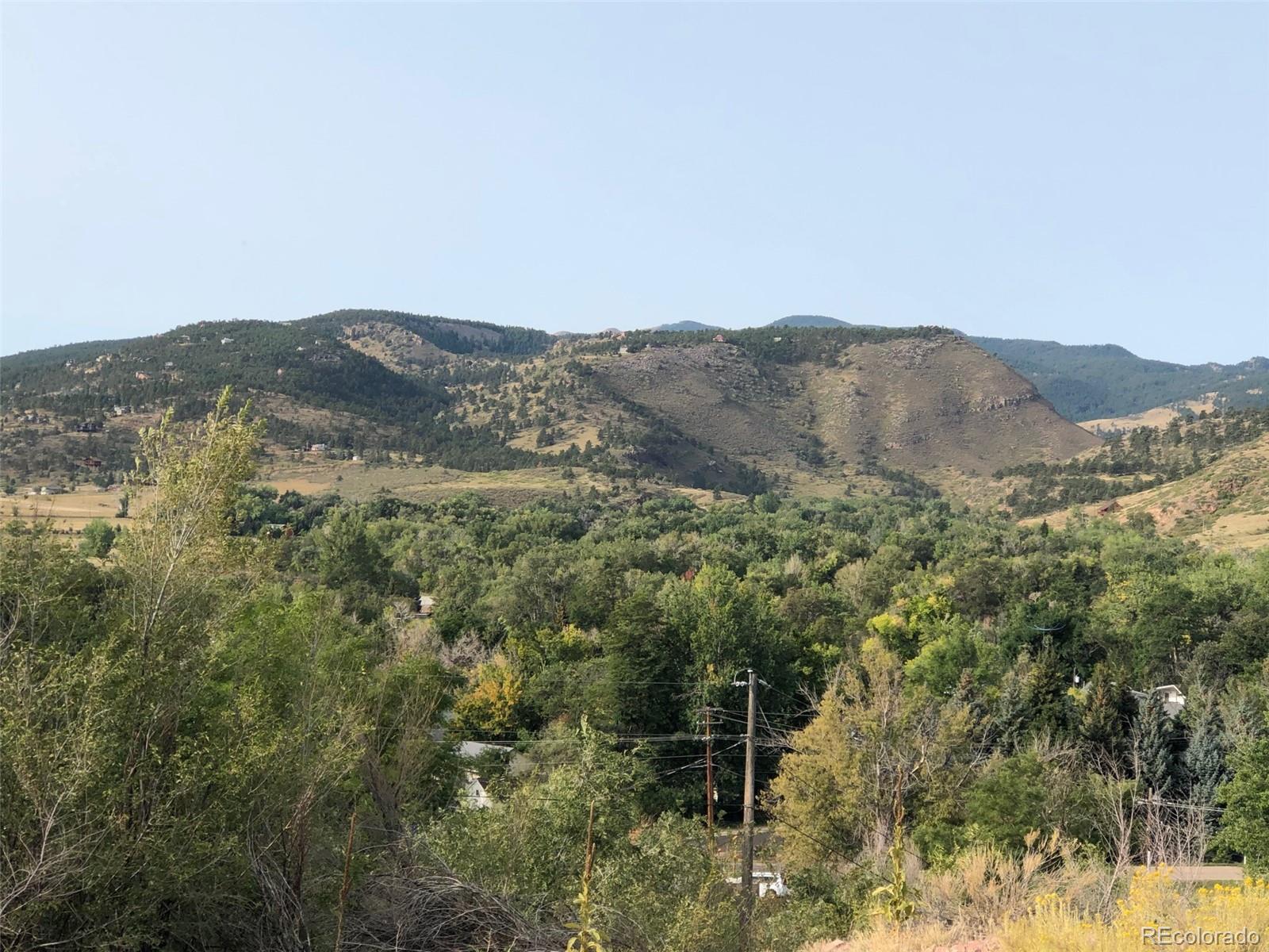 620 Overlook Drive Lyons, CO 80540 - Photo 7 of 11 a view of a mountain range with trees in the background