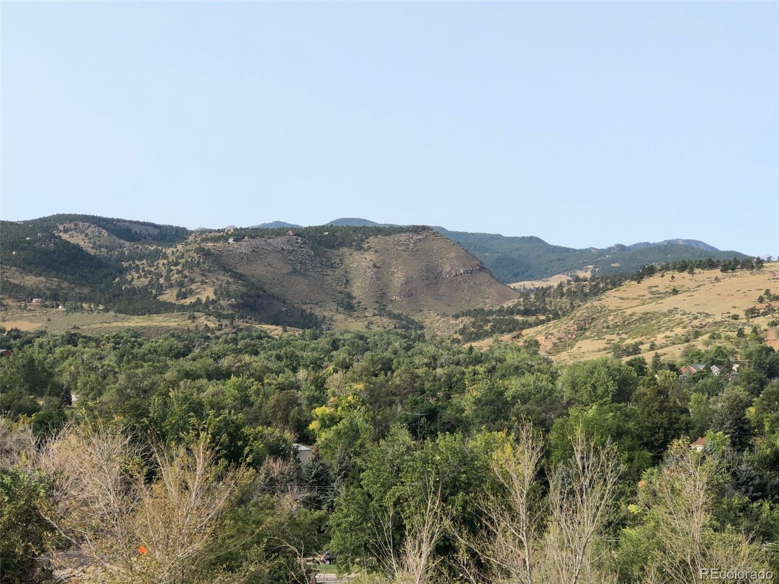 620 Overlook Drive Lyons, CO 80540 - Photo 9 of 11 a view of a mountain range with lush green forest
