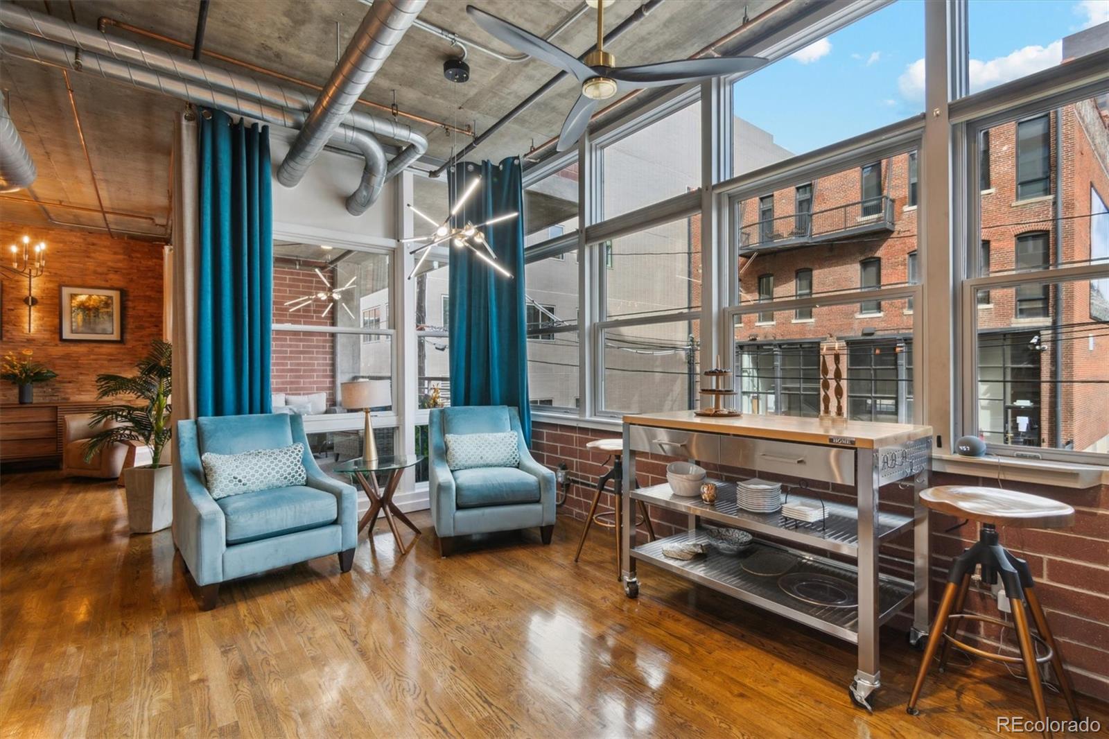 1720 Wazee Street, Unit 2B Denver, CO 80202 - Photo 9 of 17 a living room with furniture and a window